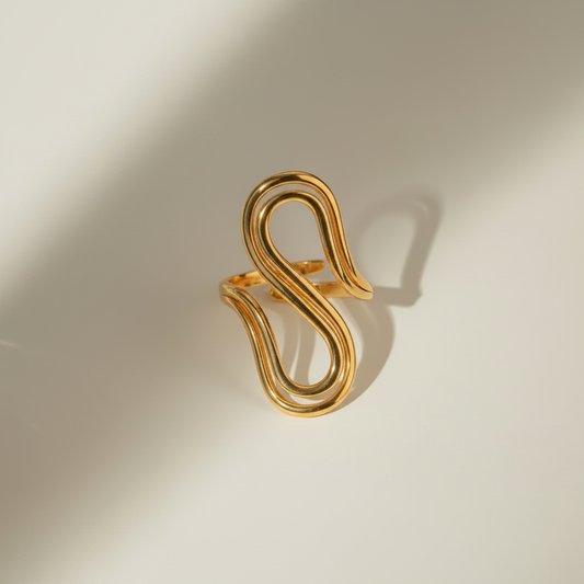 Golden S-Shape Open Ring – flat lay white background
