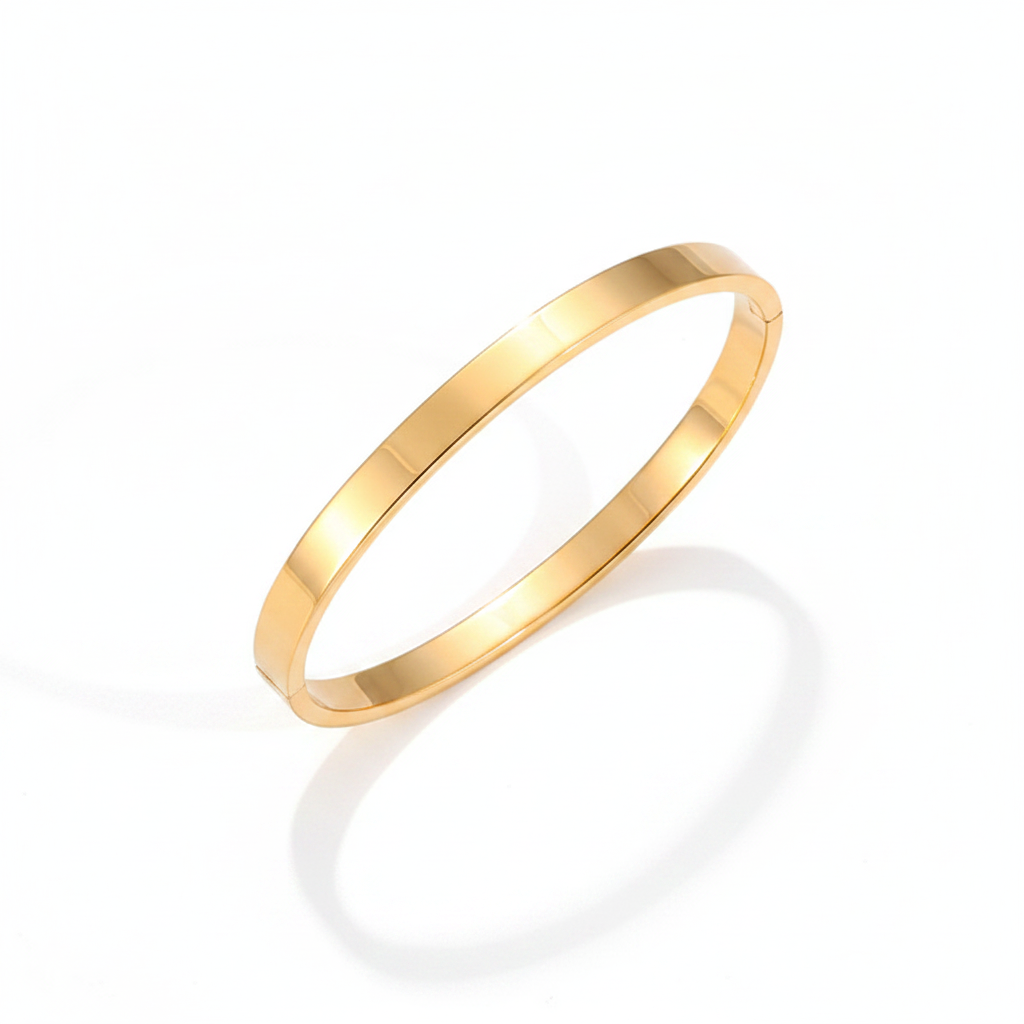 Gold polished hinged bangle bracelet on clean white background
